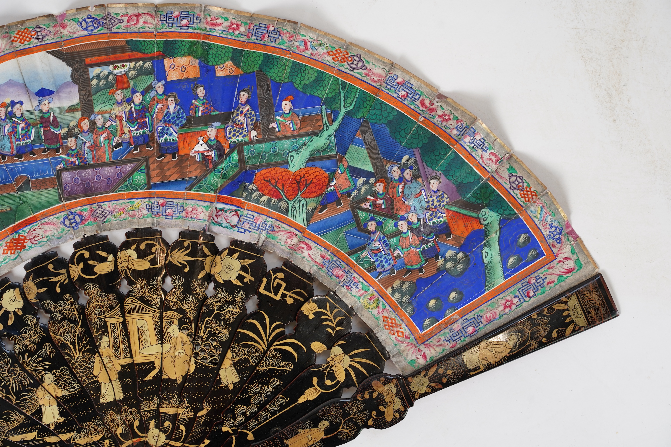 Three Chinese gilt-decorated black lacquer and painted leaf fans, 19th century